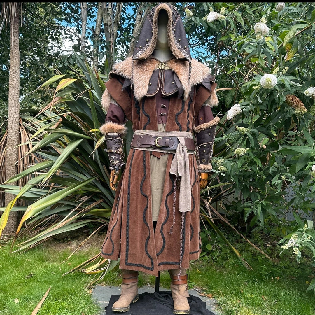 Dwarven medieval LARP set in garden, featuring hood and fur-trimmed waistcoat.